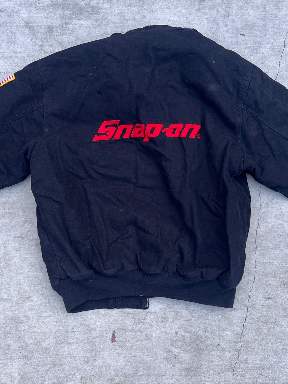 Snap-On Black Zip-Up Jacket with Red Snap-on Logo.